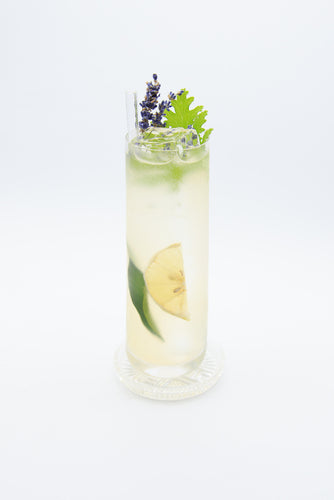 Bergamot Tonic Cocktail in a tall glass with lavendar sprig garnish