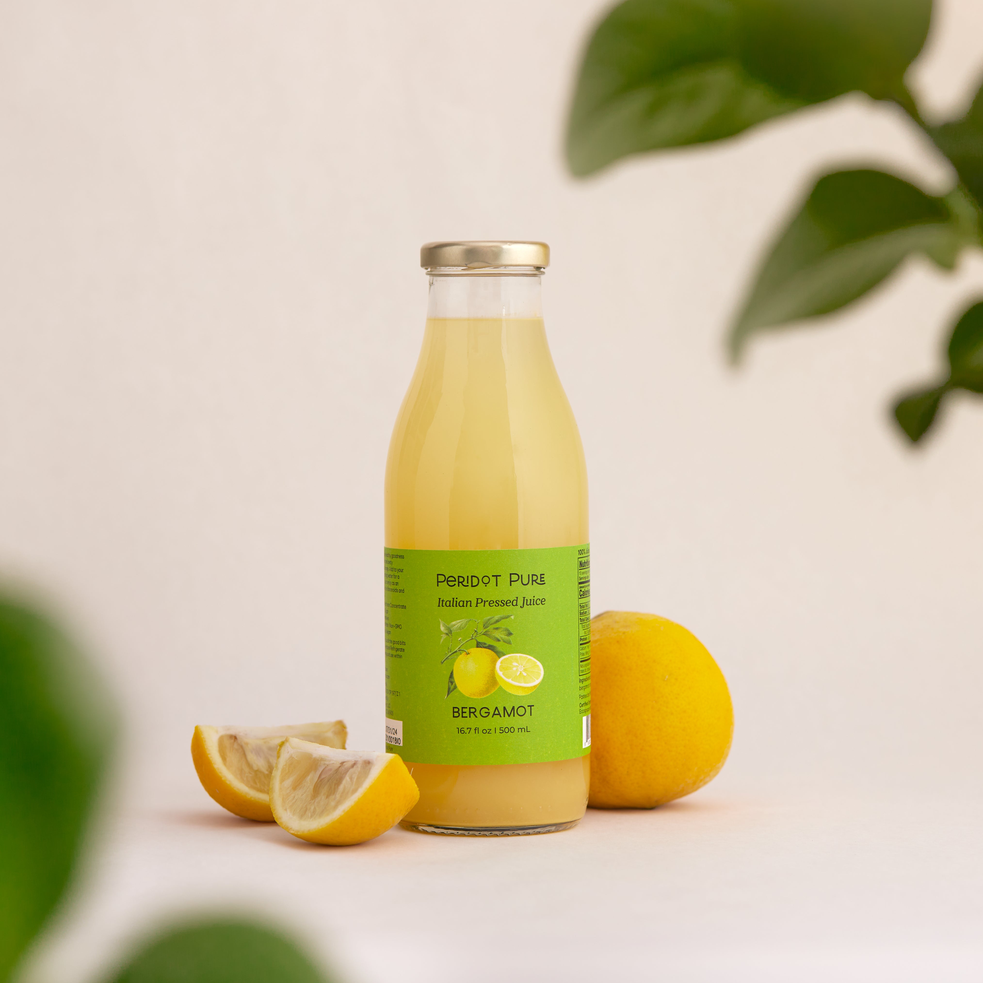 Organic Bergamot  Juice in a glass 500ml bottle with a bergamot orange and bergamot slices